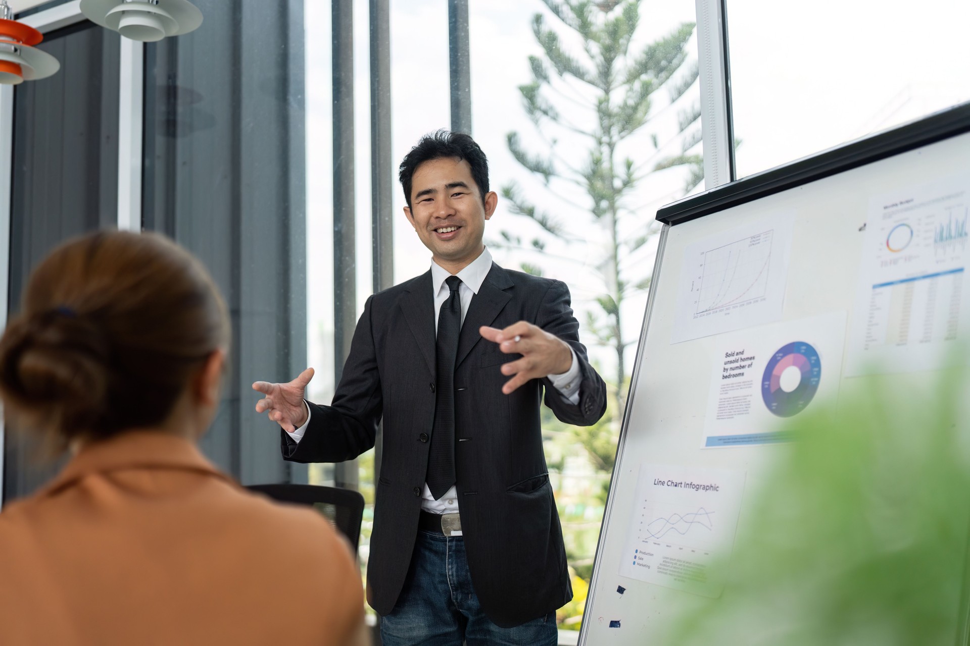 Business Meeting and Presentation. Professional team discussing data analysis in modern office.