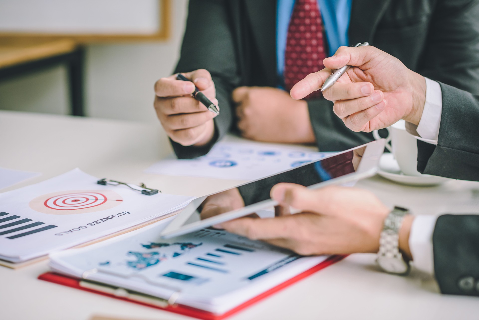 Business people are analyzing and planning business. Business Strategy Consulting